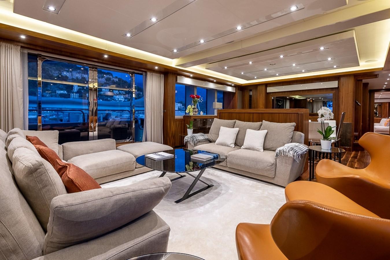 a living room with a couch and a table aboard INSIGNIA Yacht for Sale
