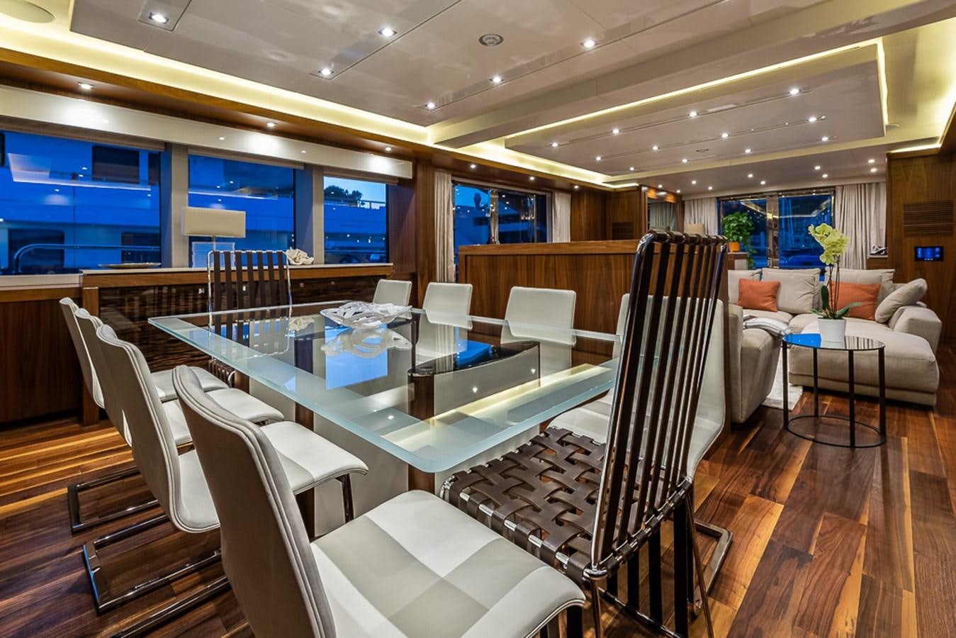 a room with a table and chairs aboard INSIGNIA Yacht for Sale