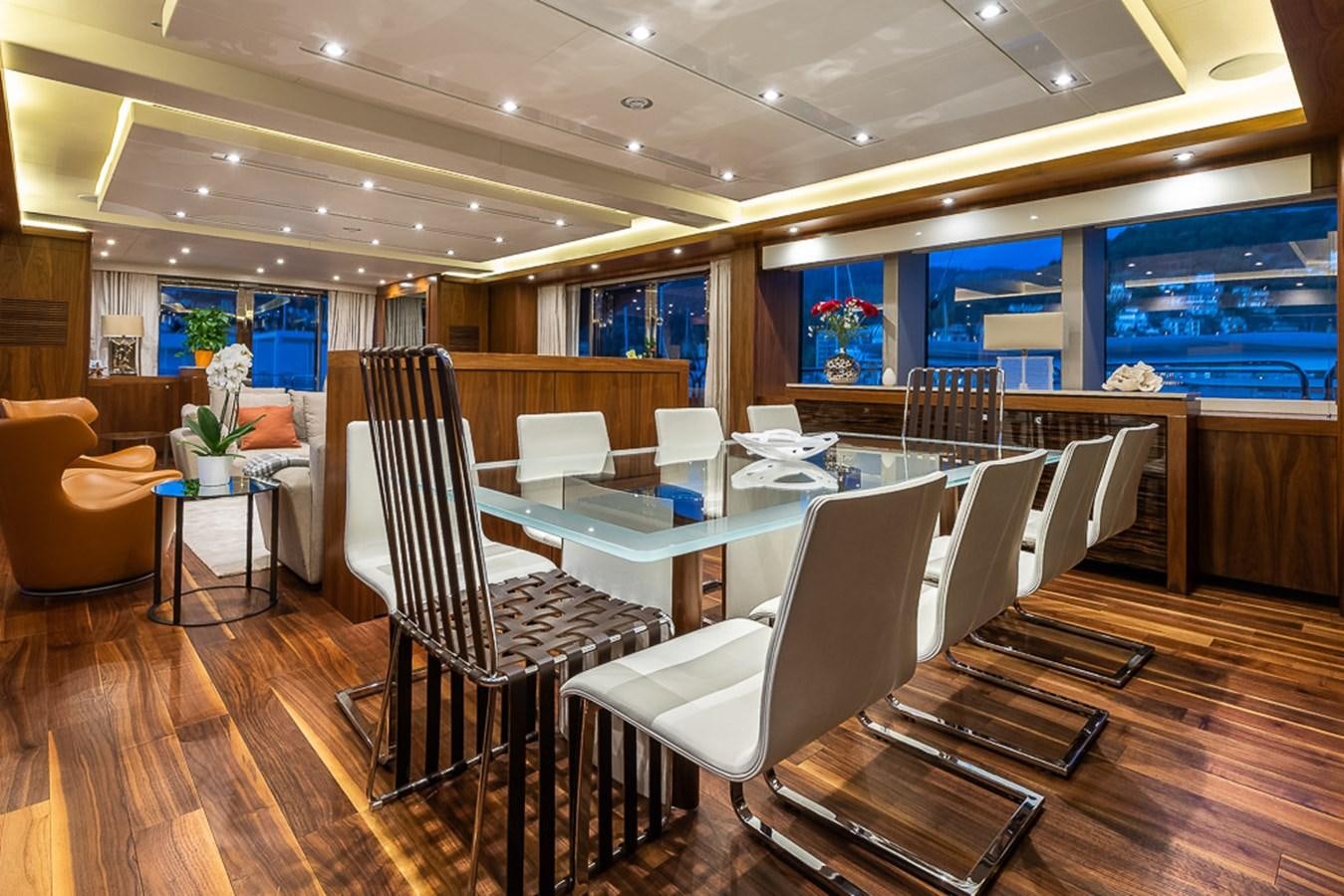 a room with a table chairs and a large window aboard INSIGNIA Yacht for Sale