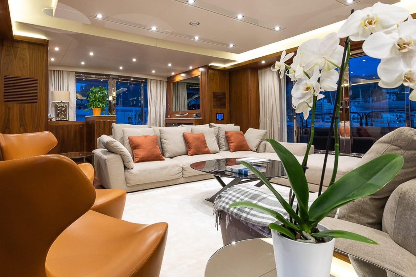 a living room with a large glass window aboard INSIGNIA Yacht for Sale