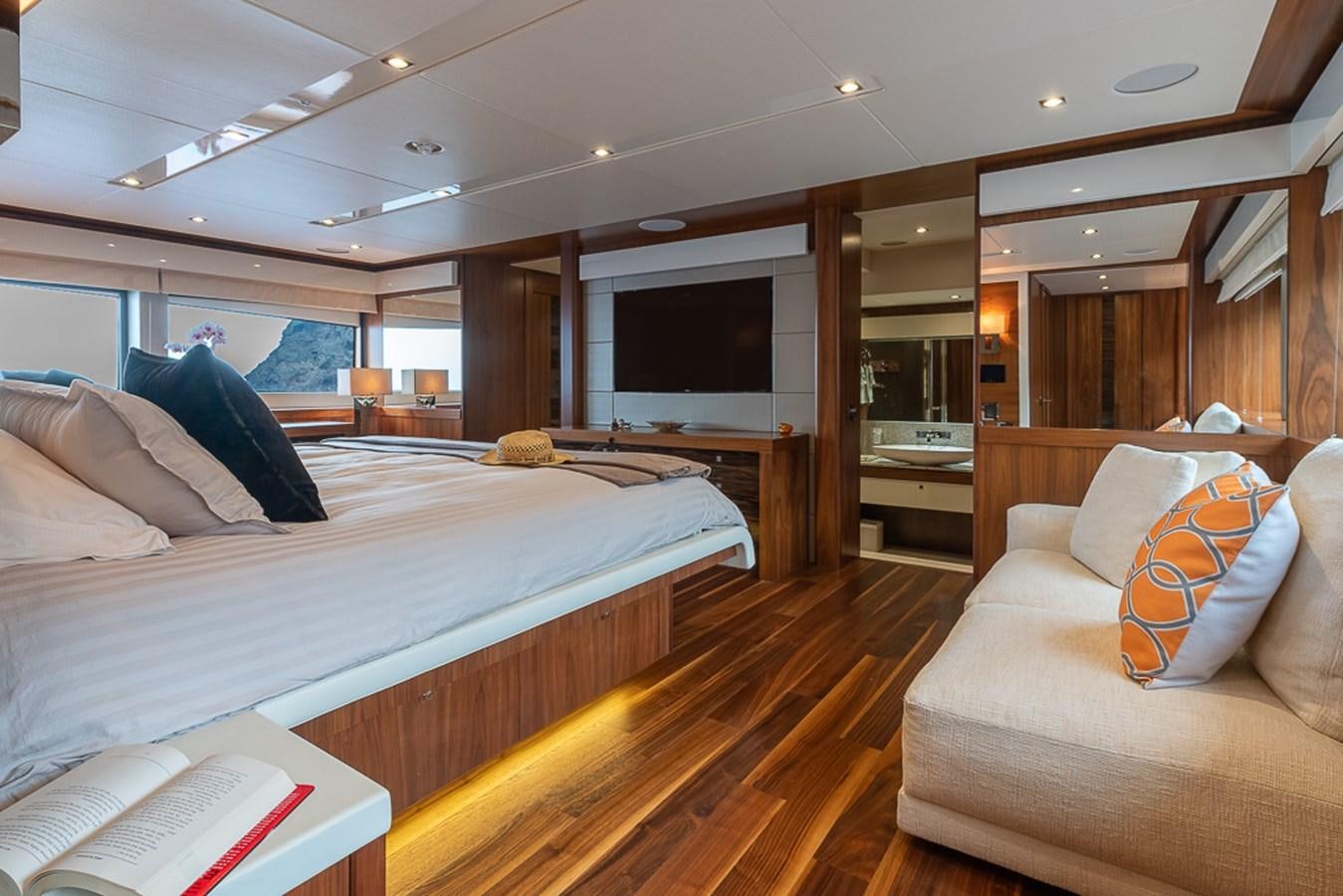 a bedroom with a large bed aboard INSIGNIA Yacht for Sale