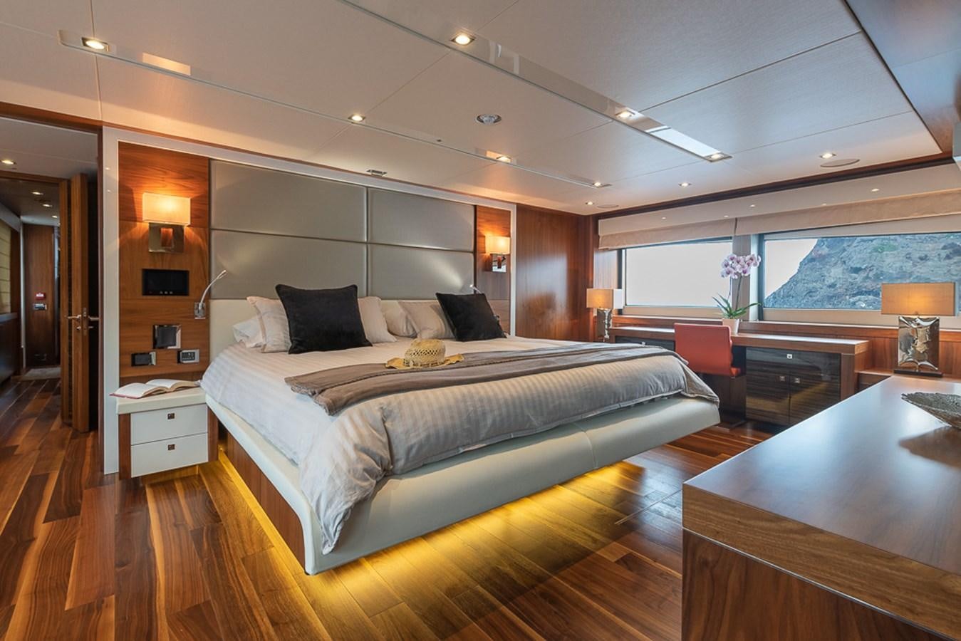a large bedroom with a large bed aboard INSIGNIA Yacht for Sale