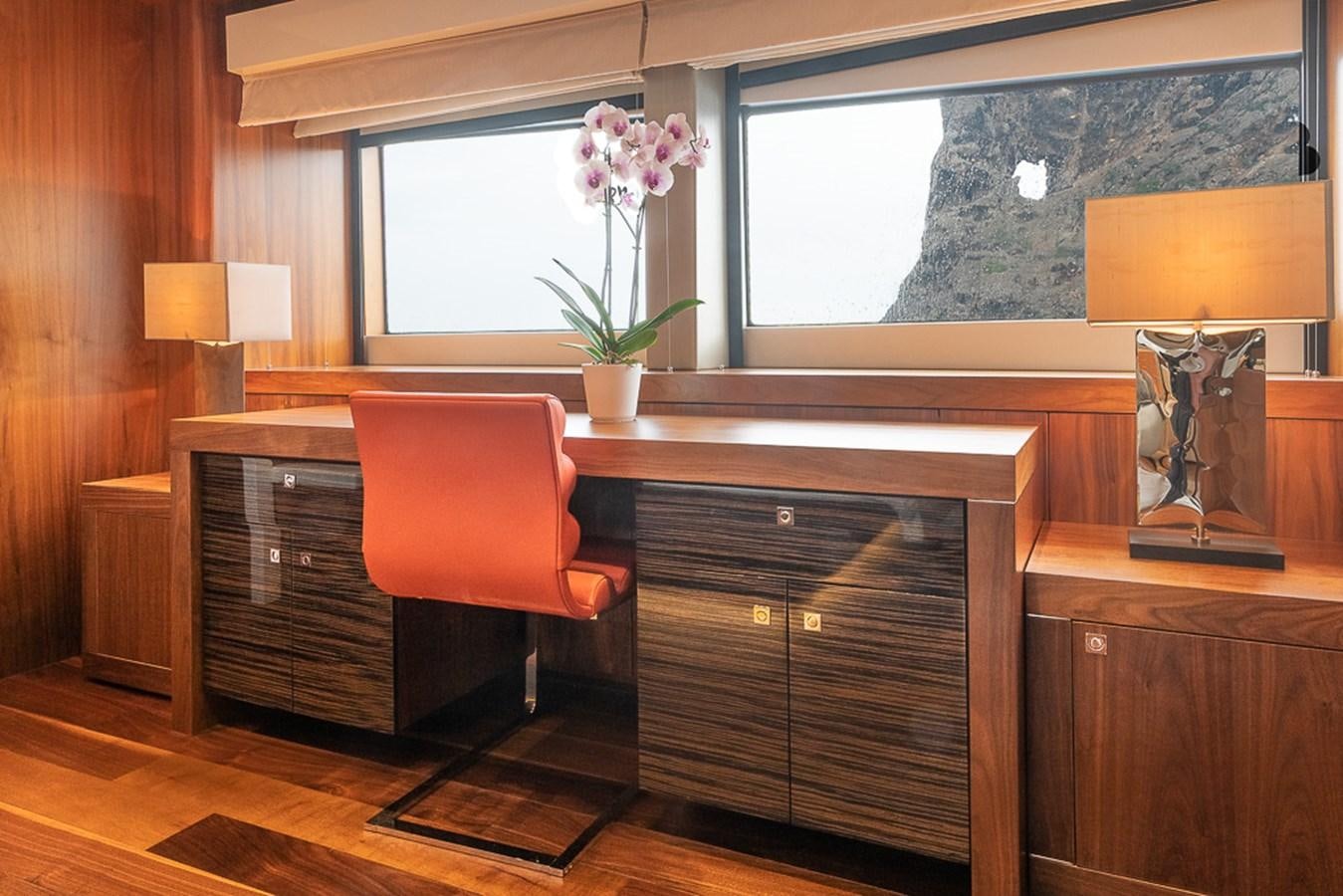 a room with a desk and a chair aboard INSIGNIA Yacht for Sale