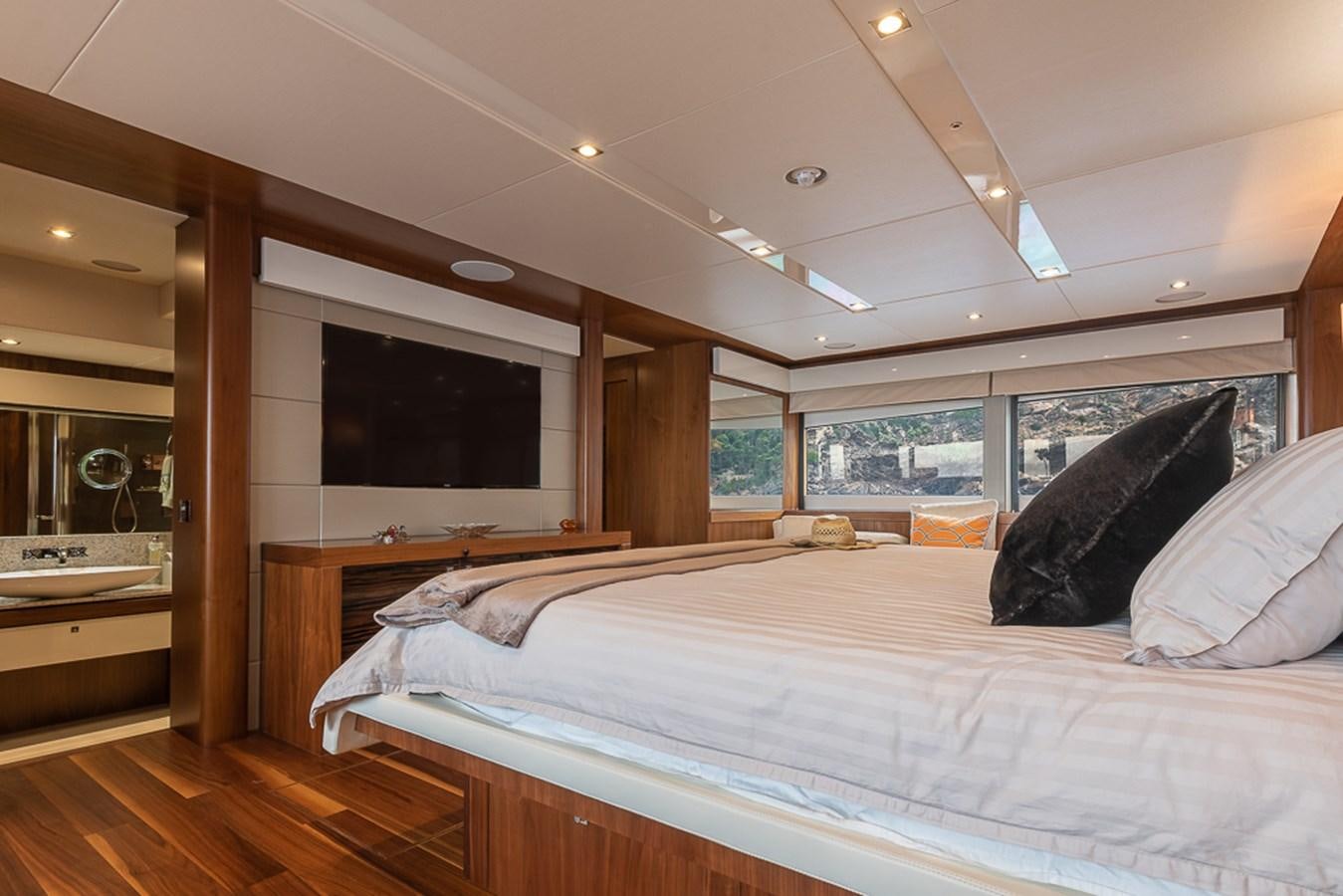 a bedroom with a large bed aboard INSIGNIA Yacht for Sale