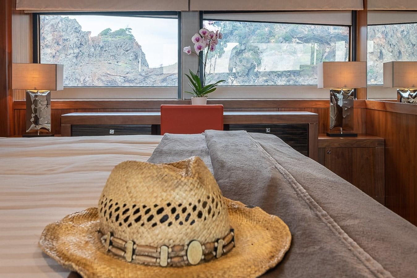 a bed with a pillow and pillows aboard INSIGNIA Yacht for Sale