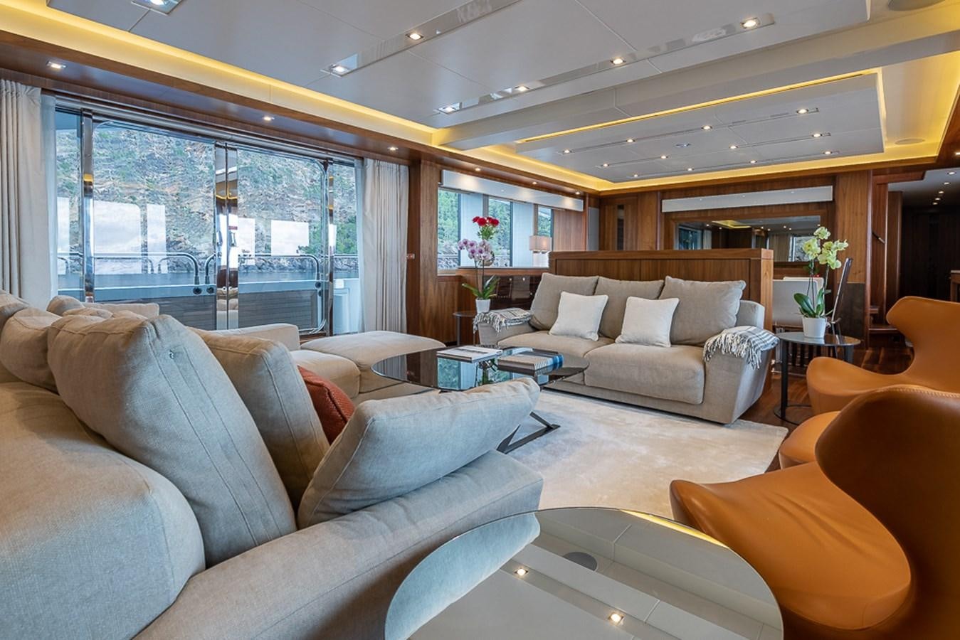 a living room with a large window aboard INSIGNIA Yacht for Sale