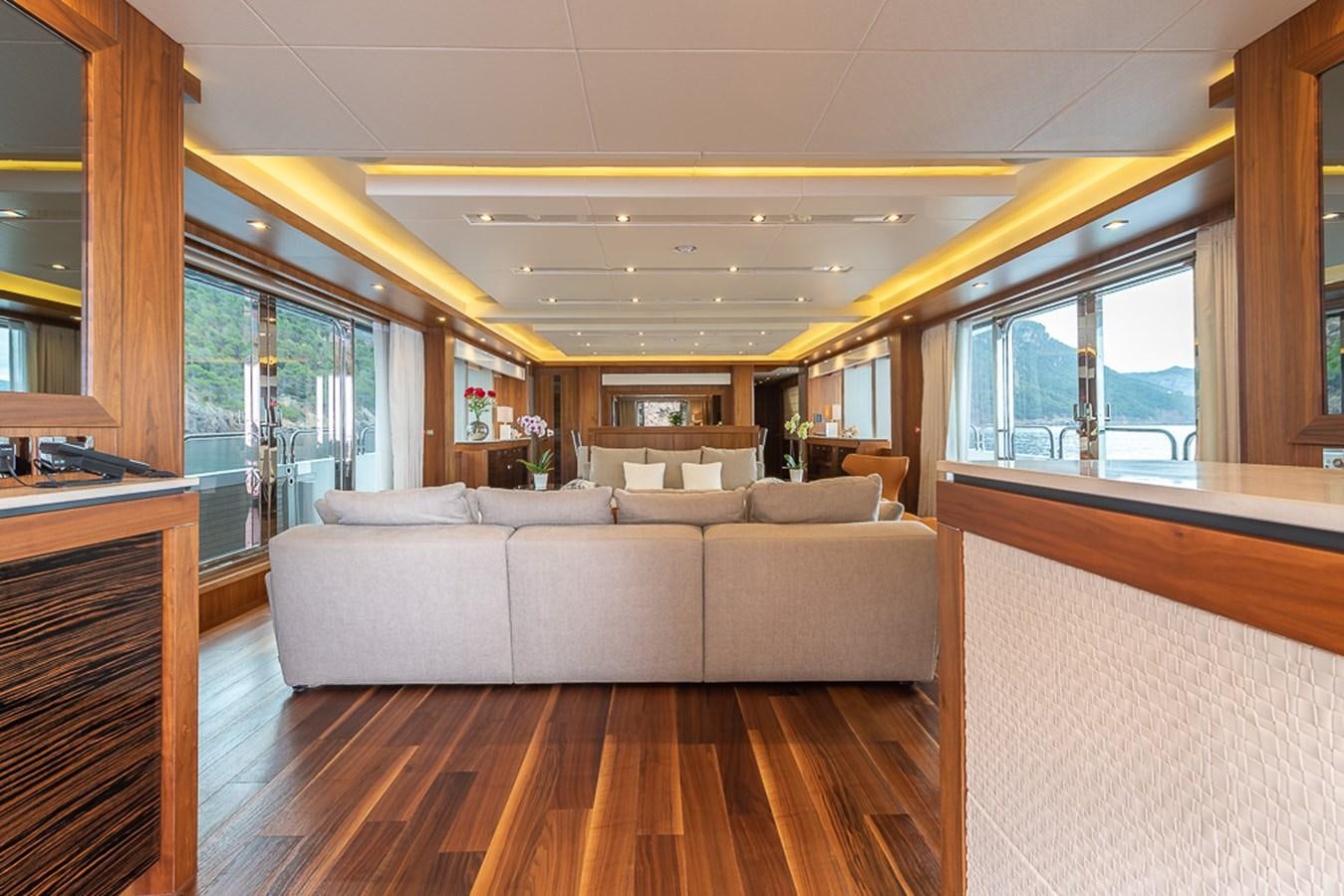 a living room with a large window aboard INSIGNIA Yacht for Sale