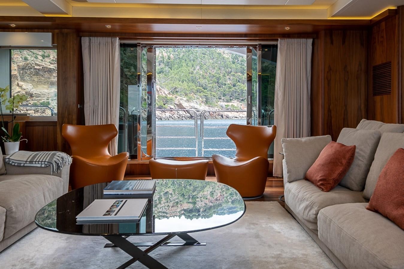 a living room with a large window aboard INSIGNIA Yacht for Sale