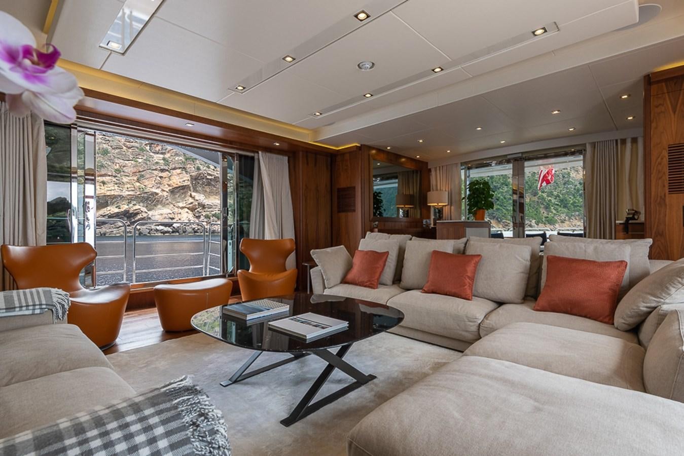 a living room with a large window aboard INSIGNIA Yacht for Sale
