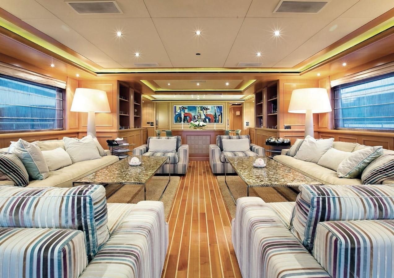 a living room with a couch and a table aboard HANA Yacht for Charter