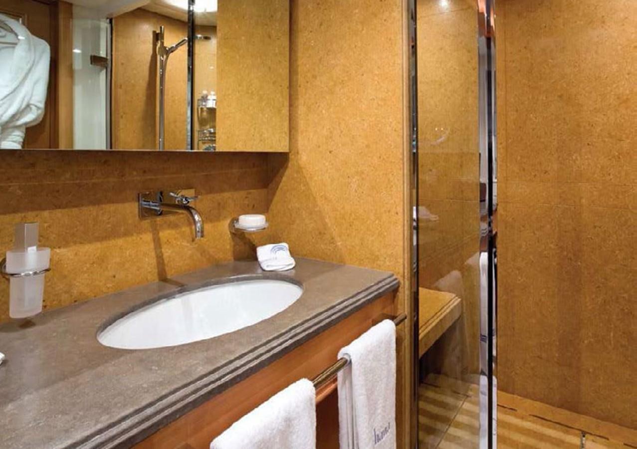 a bathroom with a sink and a mirror aboard HANA Yacht for Charter