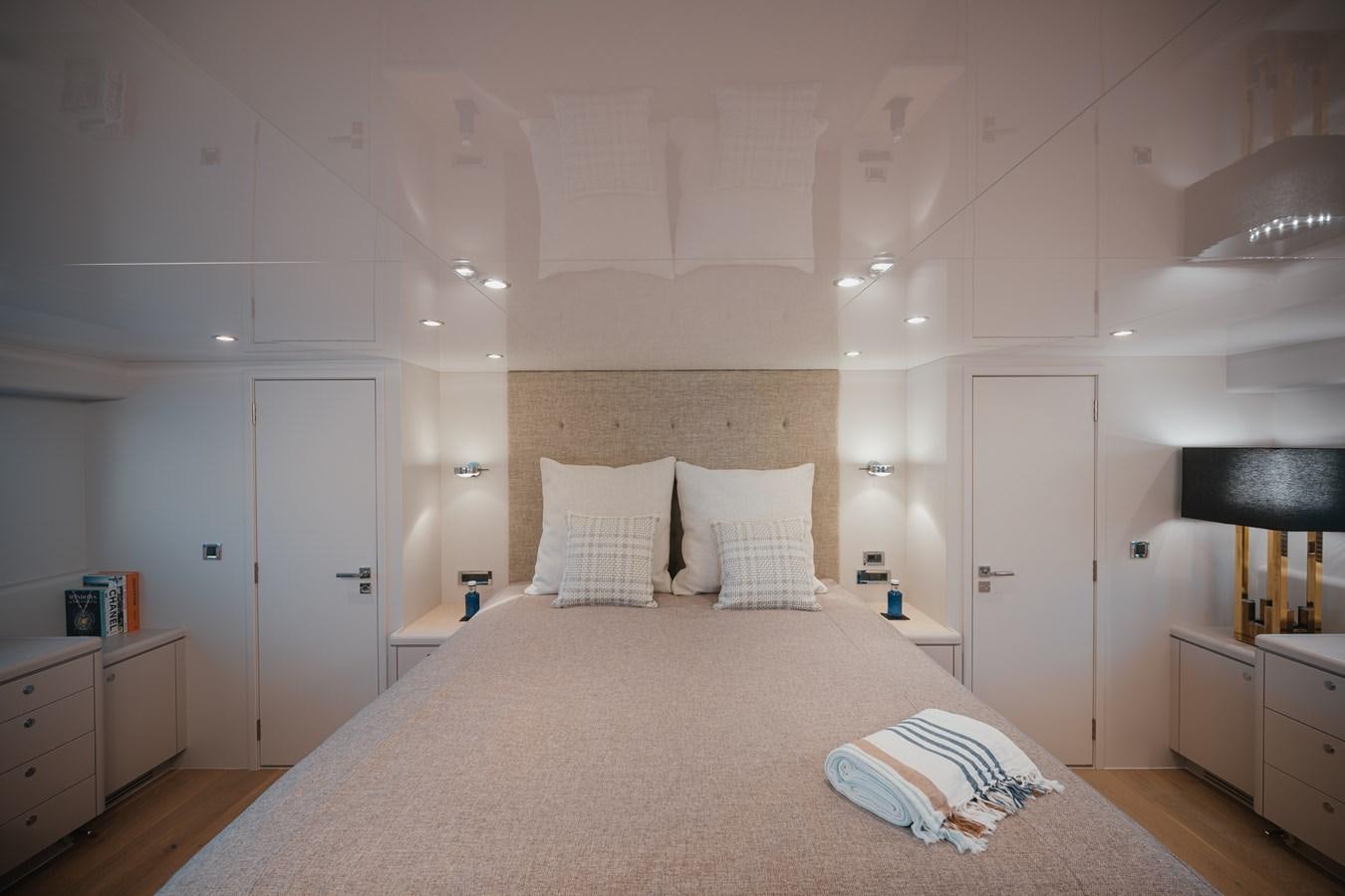 a large white bed with pillows aboard SEAL Yacht for Sale