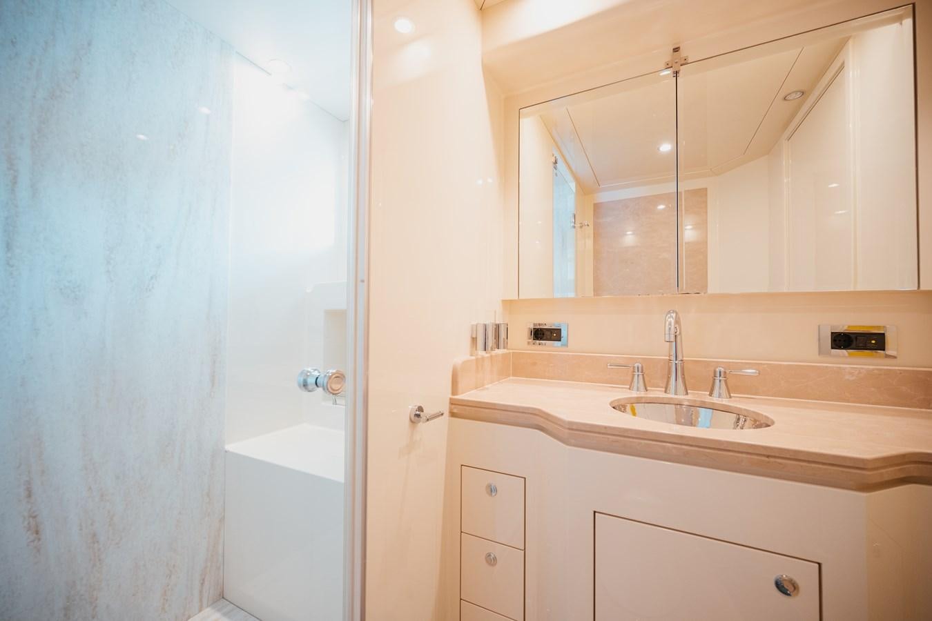 a bathroom with a sink and a bathtub aboard SEAL Yacht for Sale