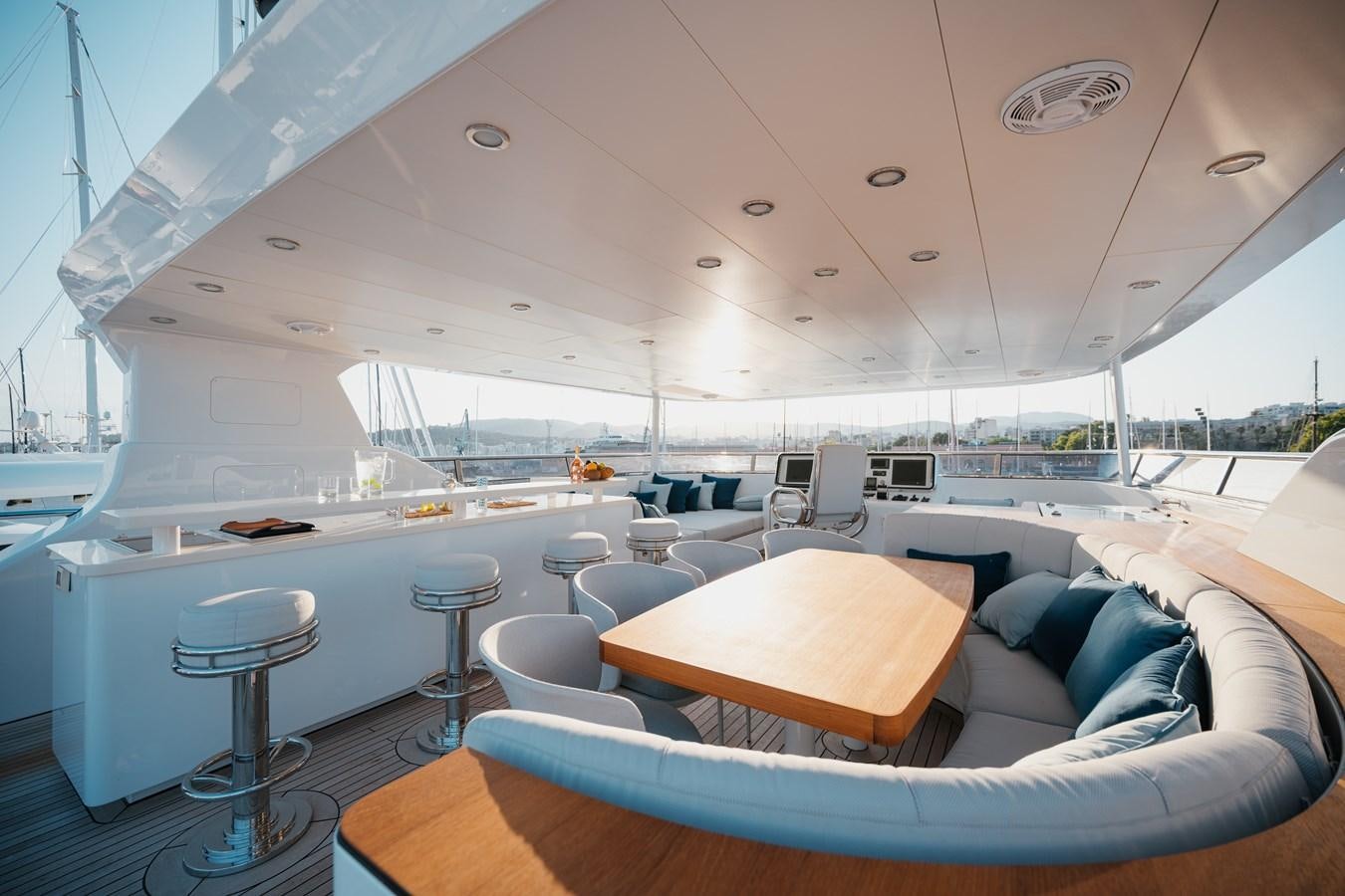 a boat with a table and chairs aboard SEAL Yacht for Sale