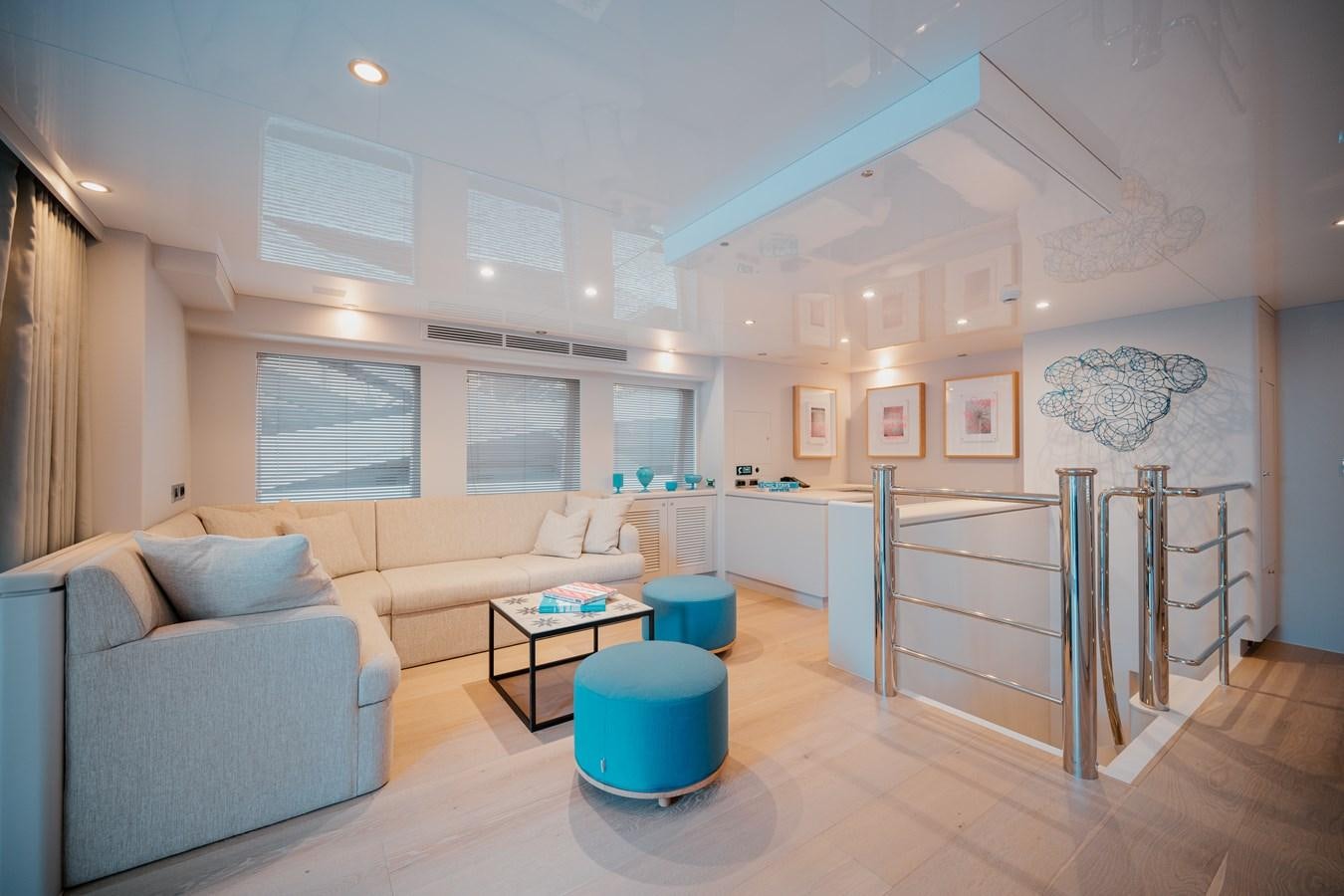 a living room with a staircase aboard SEAL Yacht for Sale