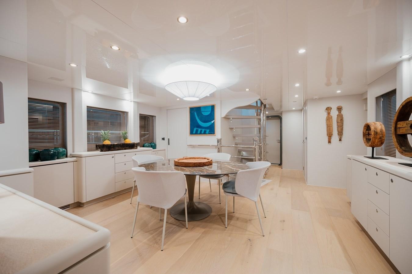 a large kitchen with white cabinets aboard SEAL Yacht for Sale