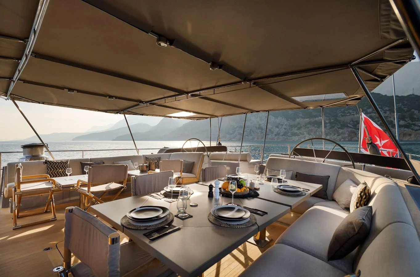 a large room with a table and chairs and a large window aboard OCEAN PURE 2 Yacht for Sale