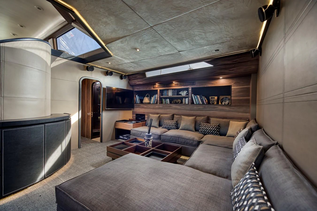 a living room with a couch and a tv aboard OCEAN PURE 2 Yacht for Sale