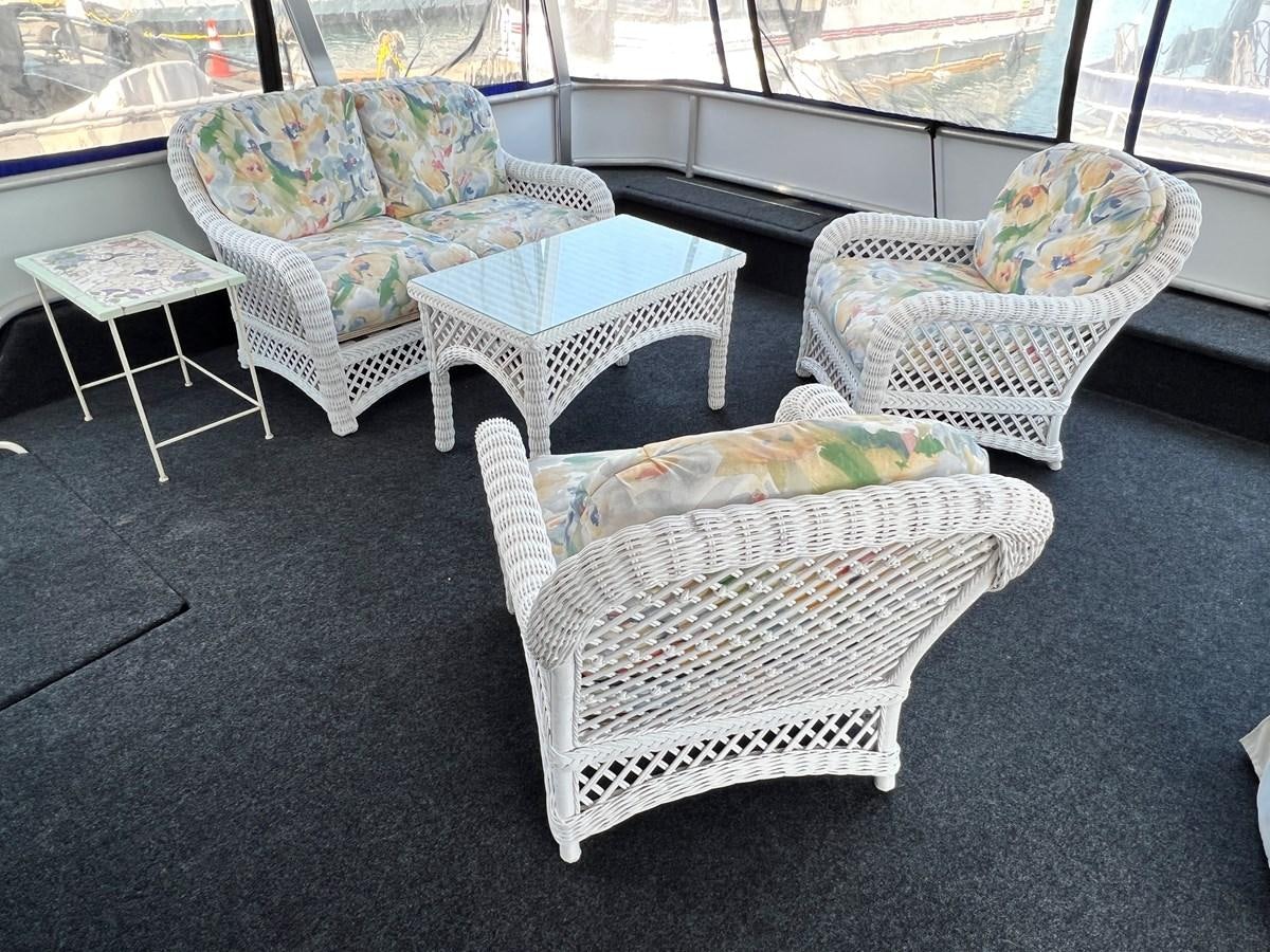 a couple of couches in a room with a window aboard 2010/1995 STARDUST 20 X 95WB NLST Yacht for Sale