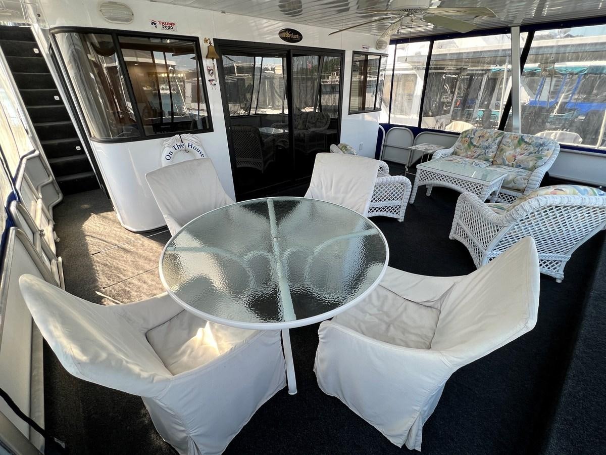 a train with a table and chairs aboard 2010/1995 STARDUST 20 X 95WB NLST Yacht for Sale