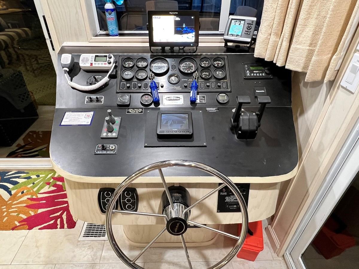 a black radio with a fan and buttons on it aboard 2010/1995 STARDUST 20 X 95WB NLST Yacht for Sale