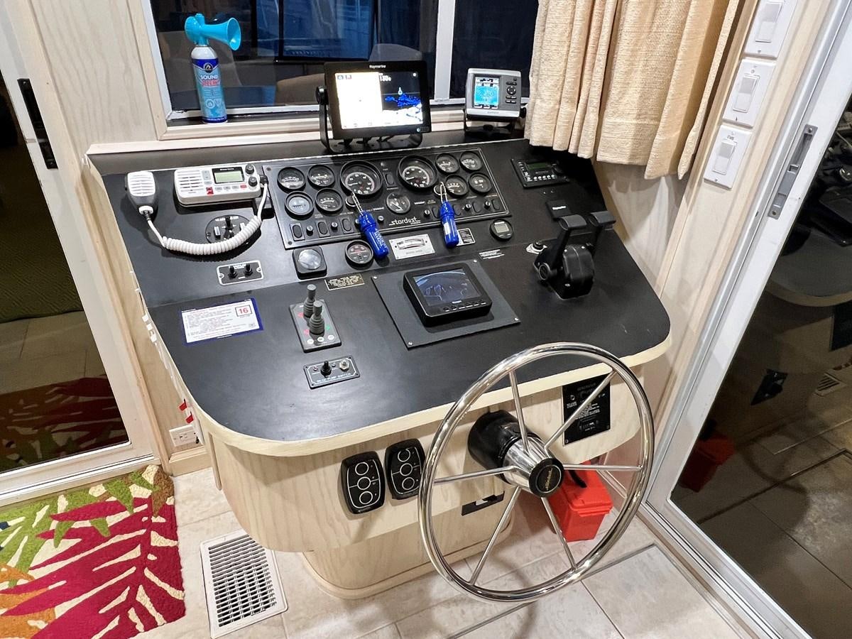 a black console with a screen and buttons on it aboard 2010/1995 STARDUST 20 X 95WB NLST Yacht for Sale