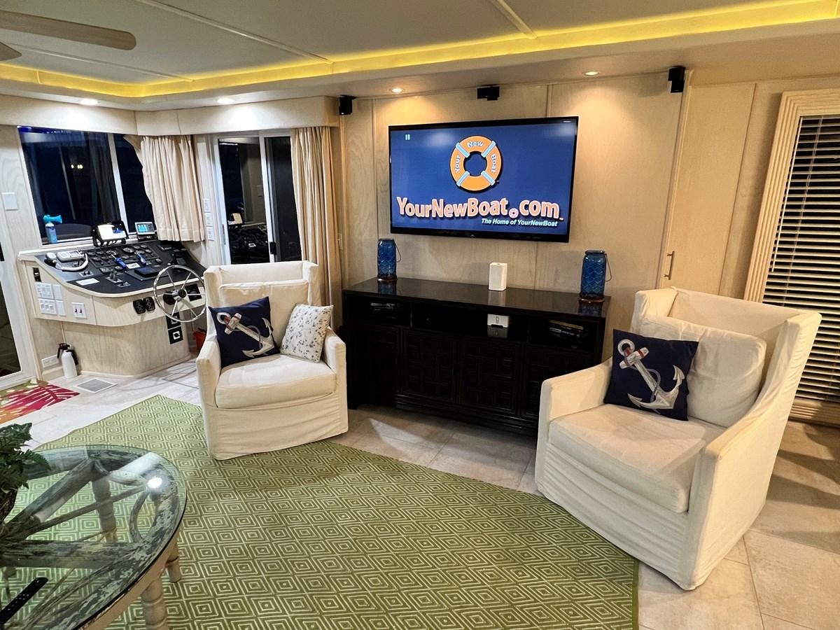 a living room with a large screen aboard 2010/1995 STARDUST 20 X 95WB NLST Yacht for Sale