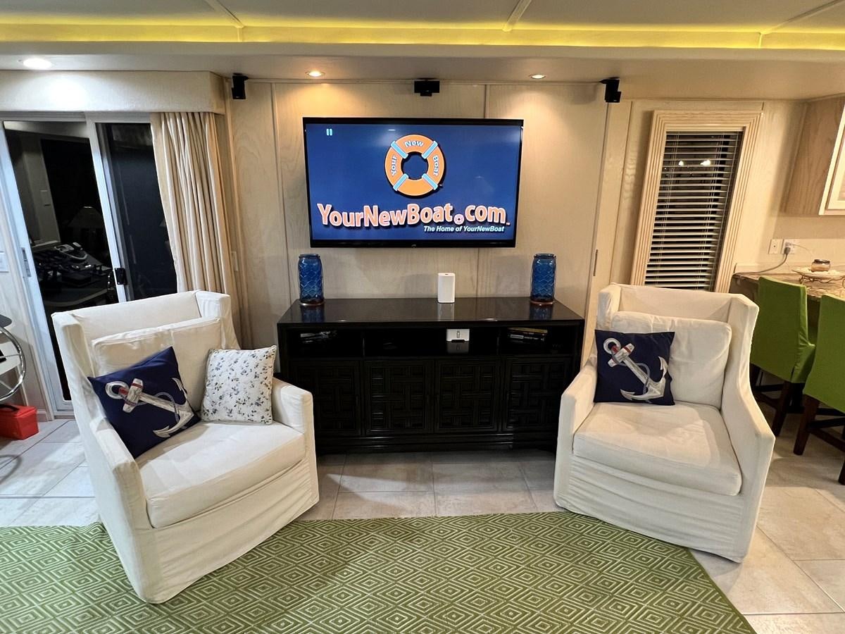 a living room with a fireplace aboard 2010/1995 STARDUST 20 X 95WB NLST Yacht for Sale