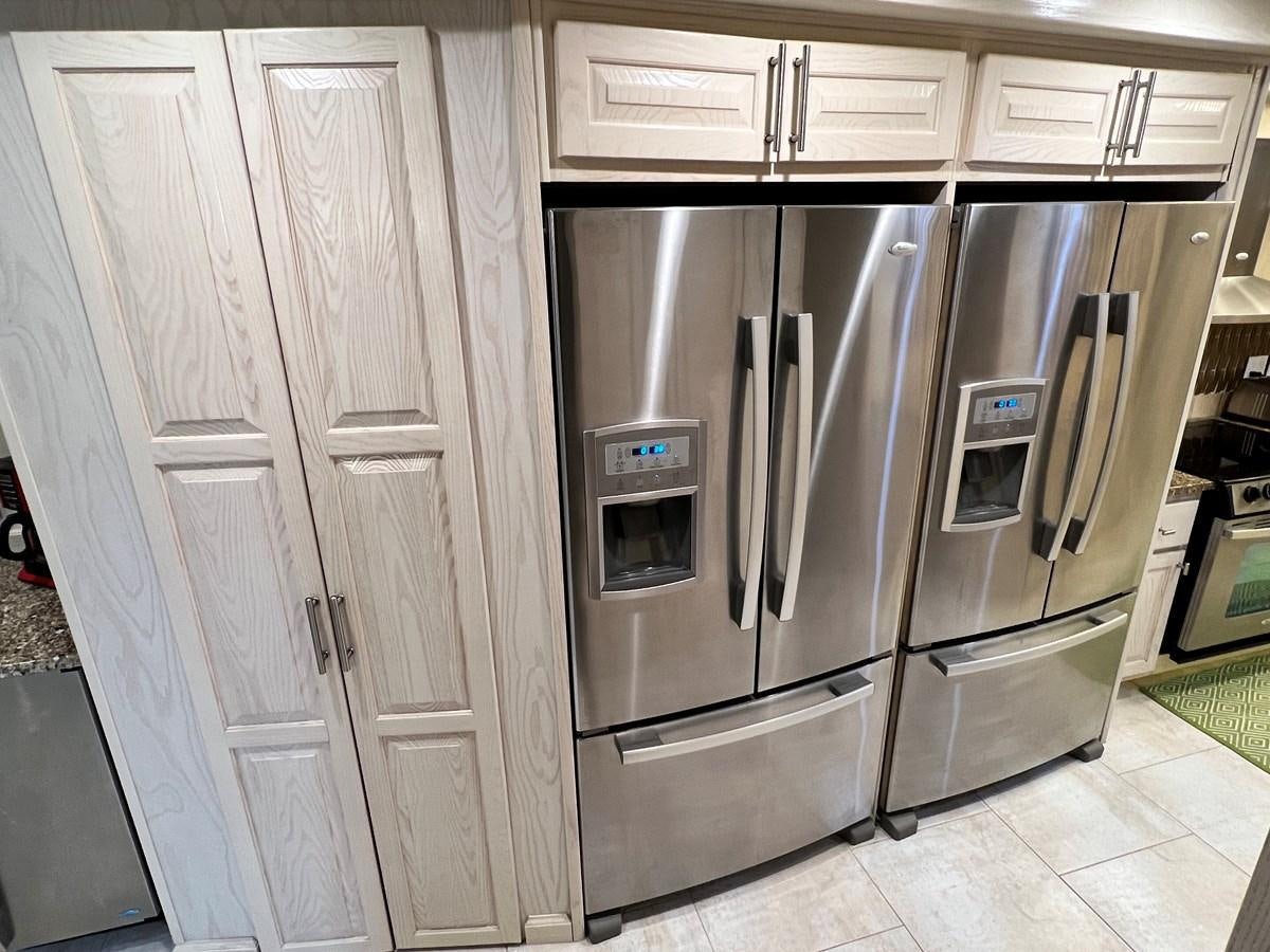 a kitchen with stainless steel appliances aboard 2010/1995 STARDUST 20 X 95WB NLST Yacht for Sale