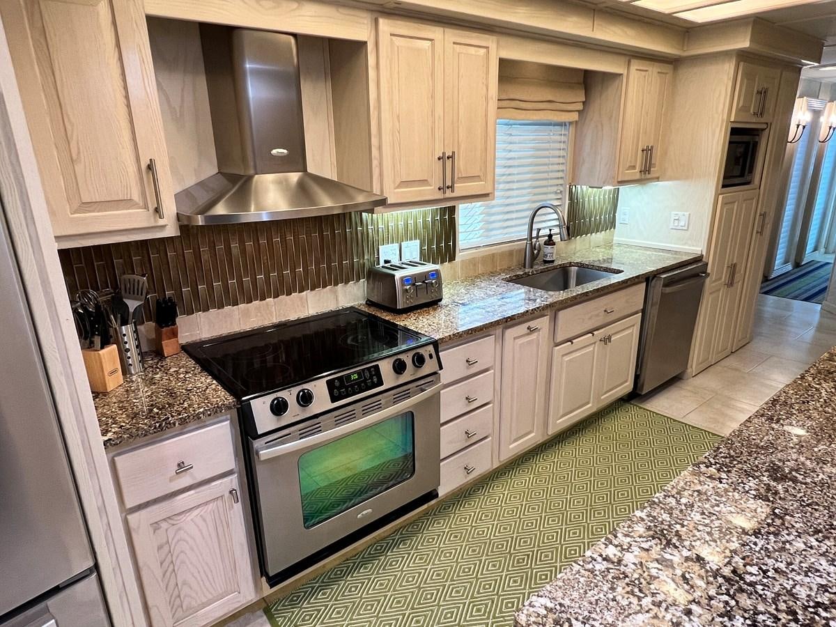 a kitchen with granite counter tops aboard 2010/1995 STARDUST 20 X 95WB NLST Yacht for Sale