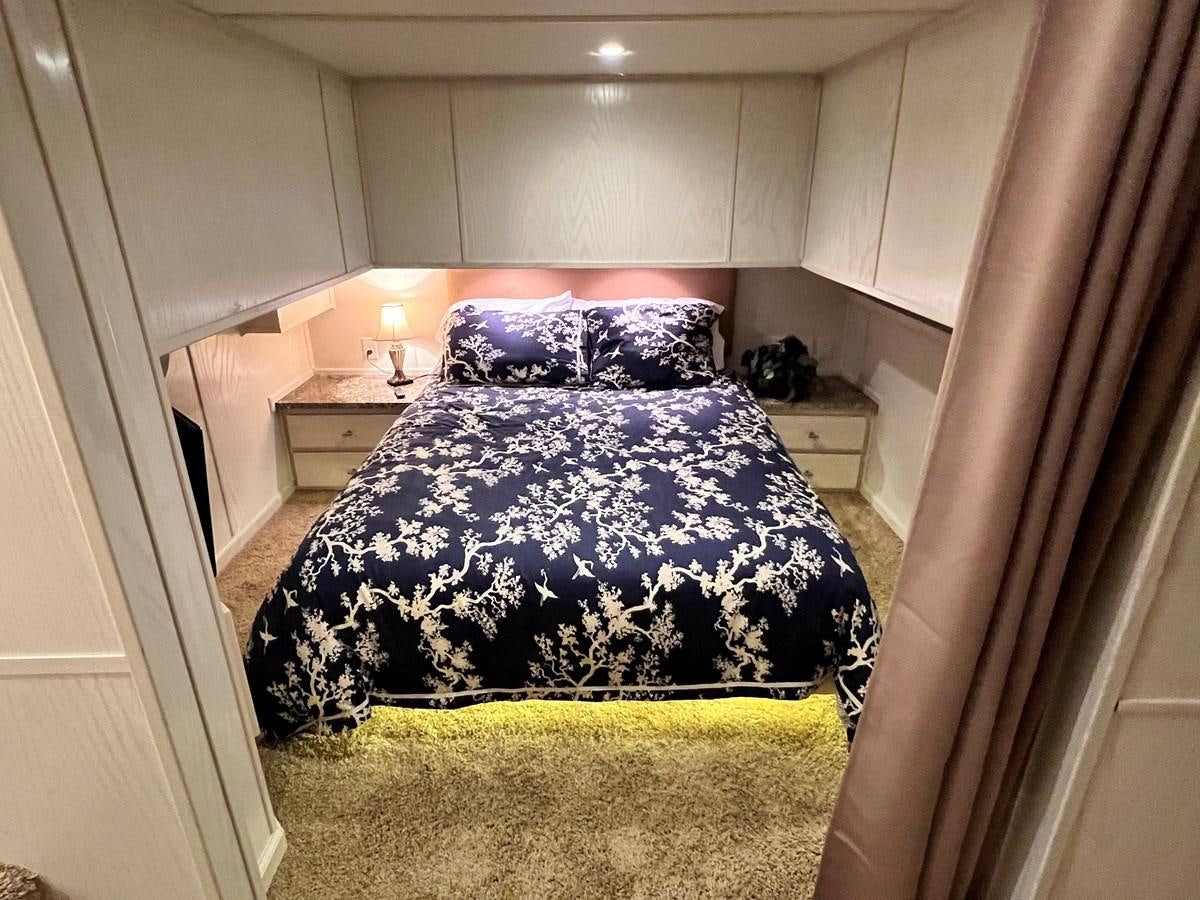 a bed in a room aboard 2010/1995 STARDUST 20 X 95WB NLST Yacht for Sale