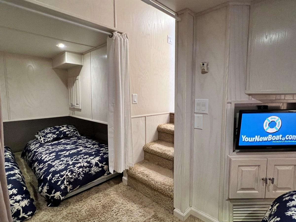 a bed in a room aboard 2010/1995 STARDUST 20 X 95WB NLST Yacht for Sale