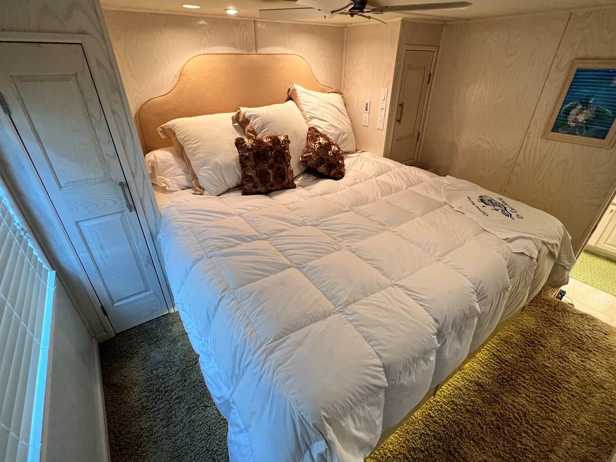 a bed with white sheets aboard 2010/1995 STARDUST 20 X 95WB NLST Yacht for Sale