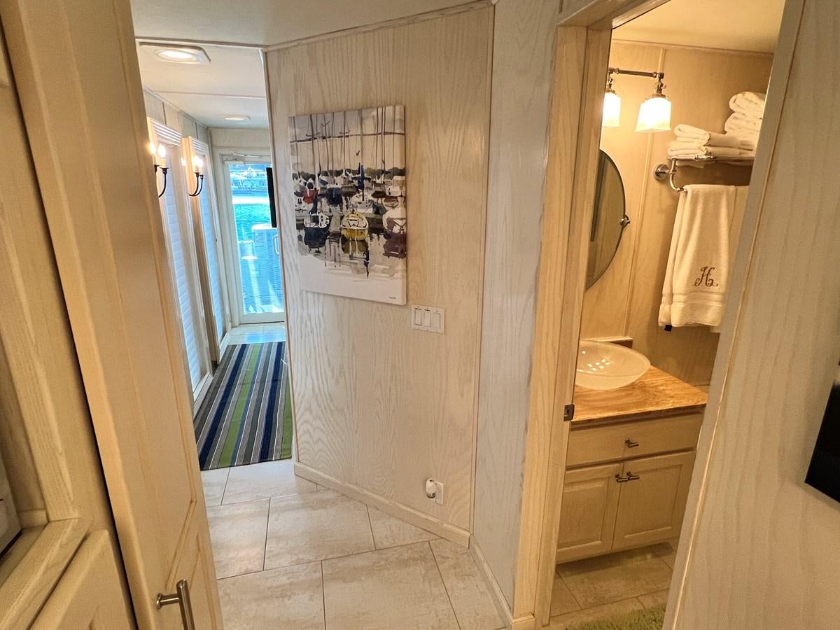 a bathroom with a sink and a mirror aboard 2010/1995 STARDUST 20 X 95WB NLST Yacht for Sale