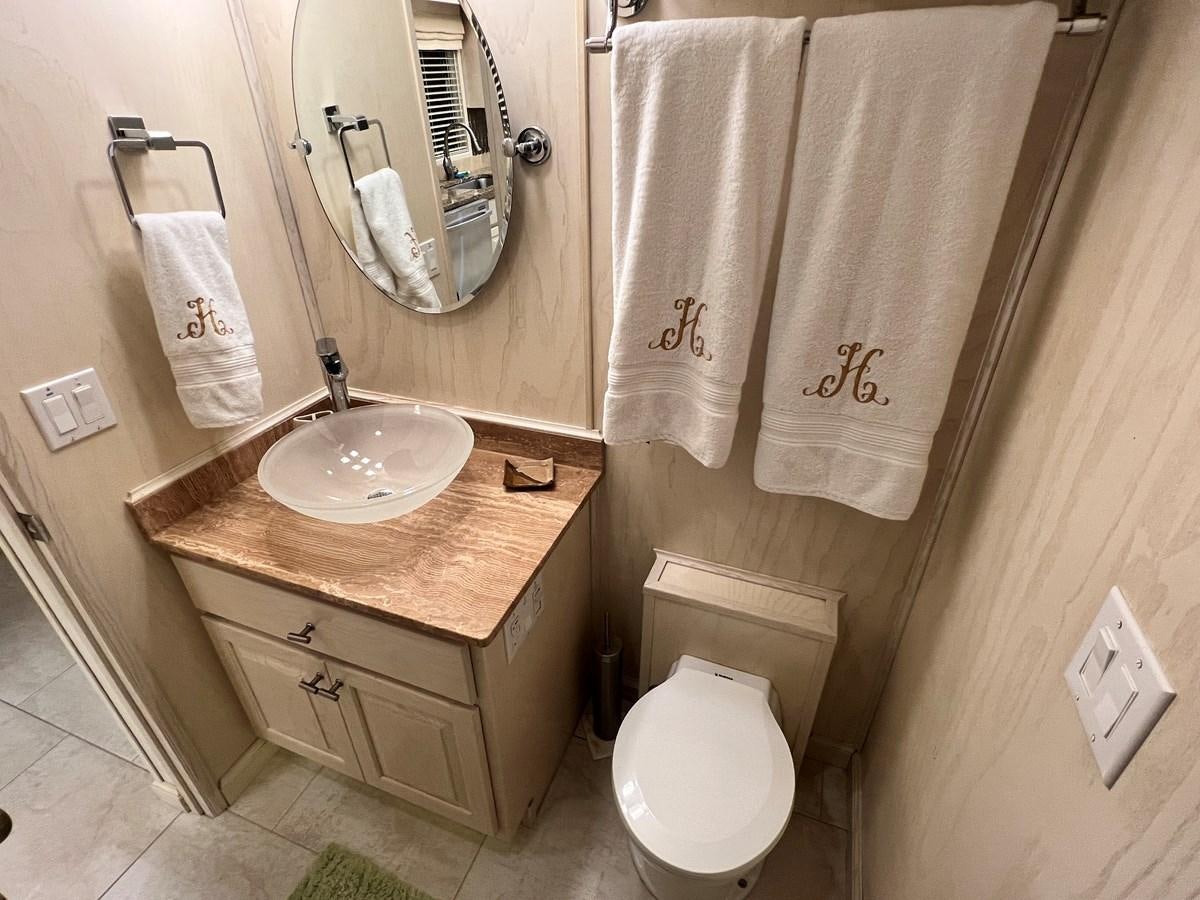 a bathroom with a sink and towels aboard 2010/1995 STARDUST 20 X 95WB NLST Yacht for Sale