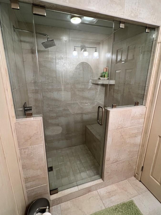 a bathroom with a glass shower aboard 2010/1995 STARDUST 20 X 95WB NLST Yacht for Sale