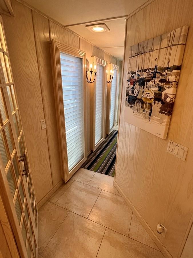 a hallway with a glass door aboard 2010/1995 STARDUST 20 X 95WB NLST Yacht for Sale