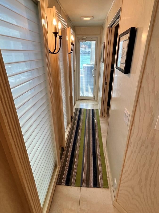 a hallway with a green rug aboard 2010/1995 STARDUST 20 X 95WB NLST Yacht for Sale