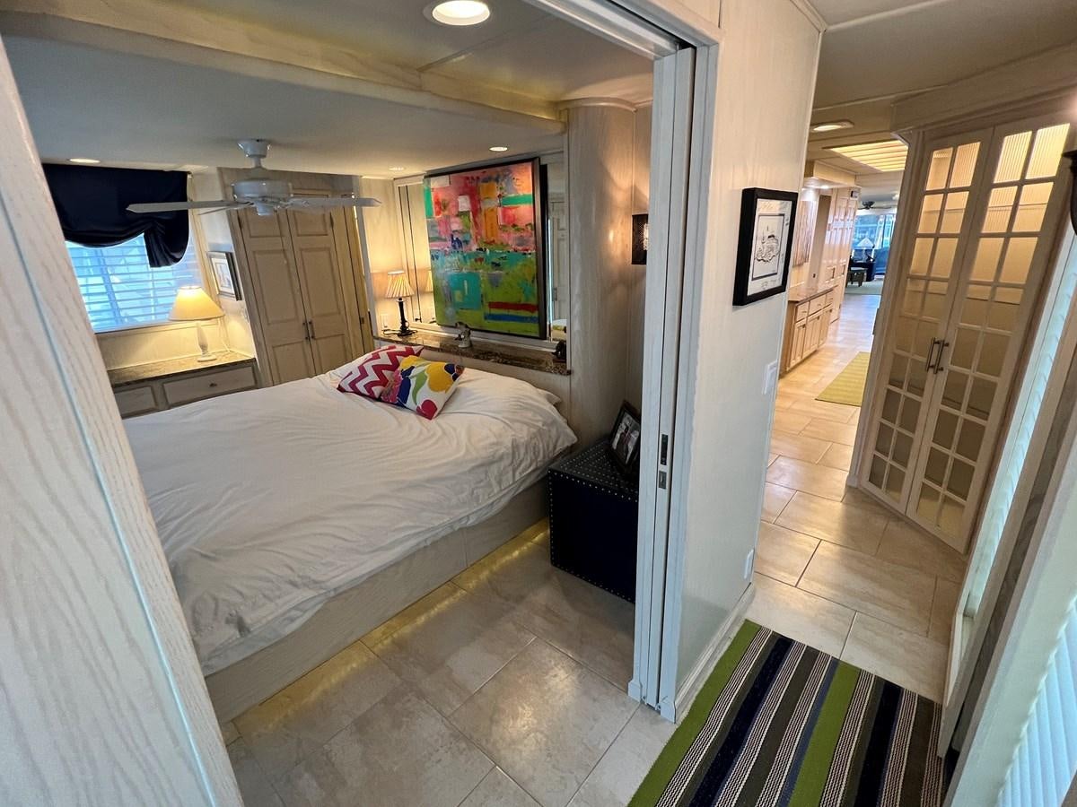 a bedroom with a bed and a door aboard 2010/1995 STARDUST 20 X 95WB NLST Yacht for Sale