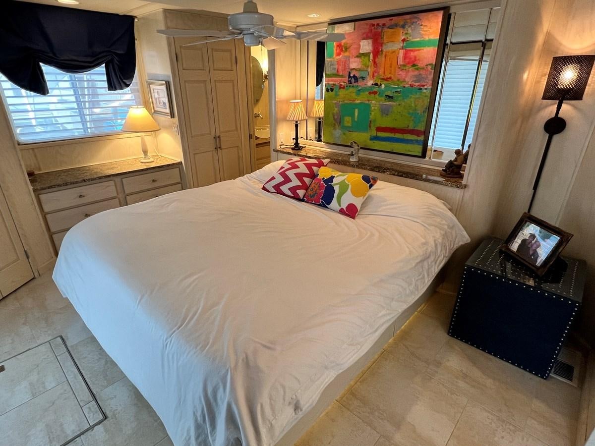 a bedroom with a large bed aboard 2010/1995 STARDUST 20 X 95WB NLST Yacht for Sale