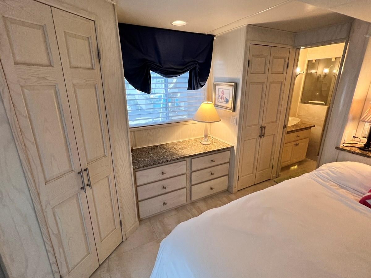 a bedroom with a bed and a closet aboard 2010/1995 STARDUST 20 X 95WB NLST Yacht for Sale