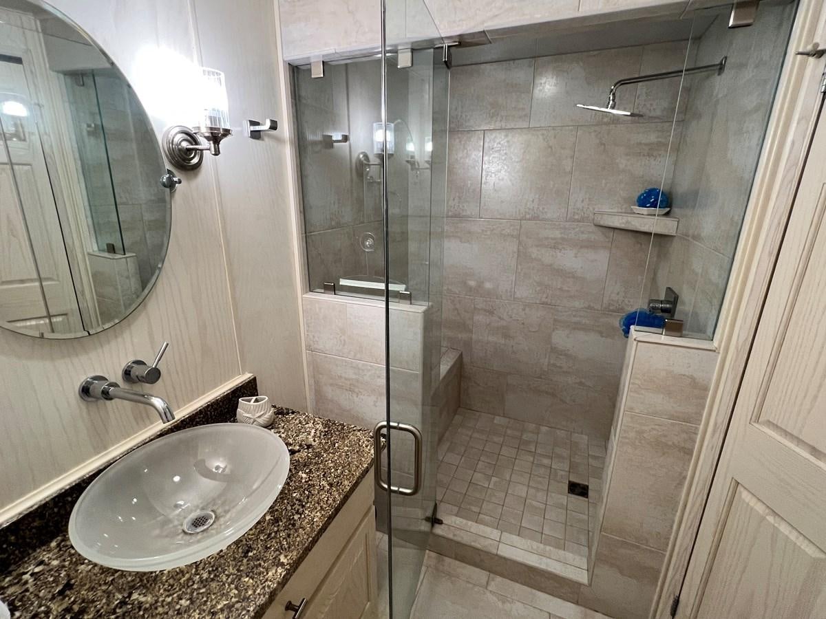 a bathroom with a sink and shower aboard 2010/1995 STARDUST 20 X 95WB NLST Yacht for Sale