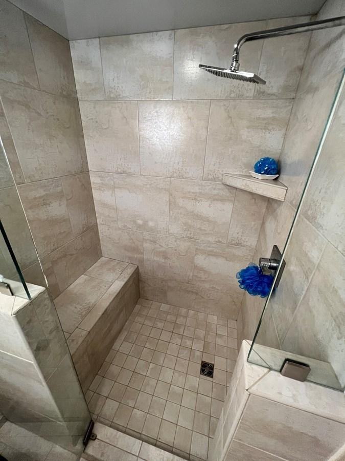 a shower with tile walls aboard 2010/1995 STARDUST 20 X 95WB NLST Yacht for Sale
