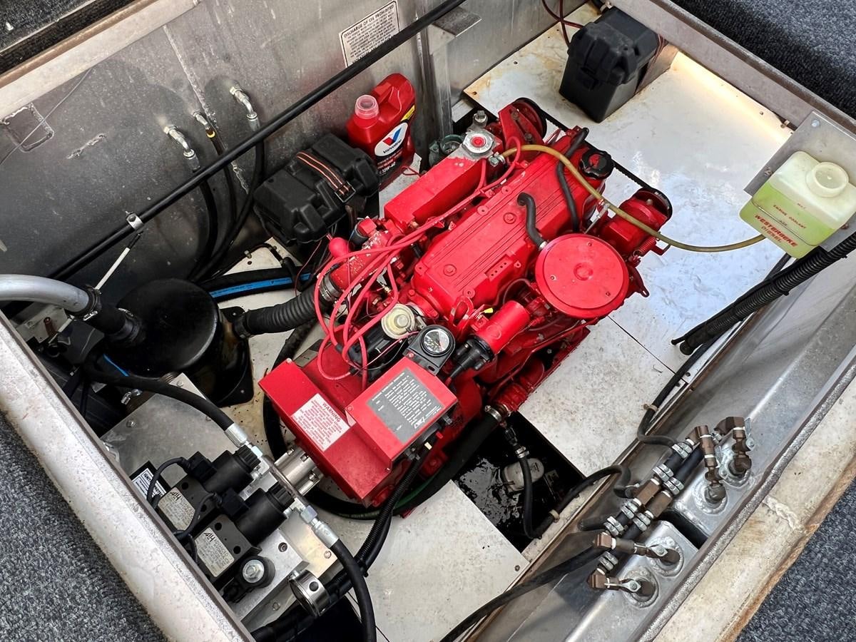 a car engine with a red car aboard 2010/1995 STARDUST 20 X 95WB NLST Yacht for Sale