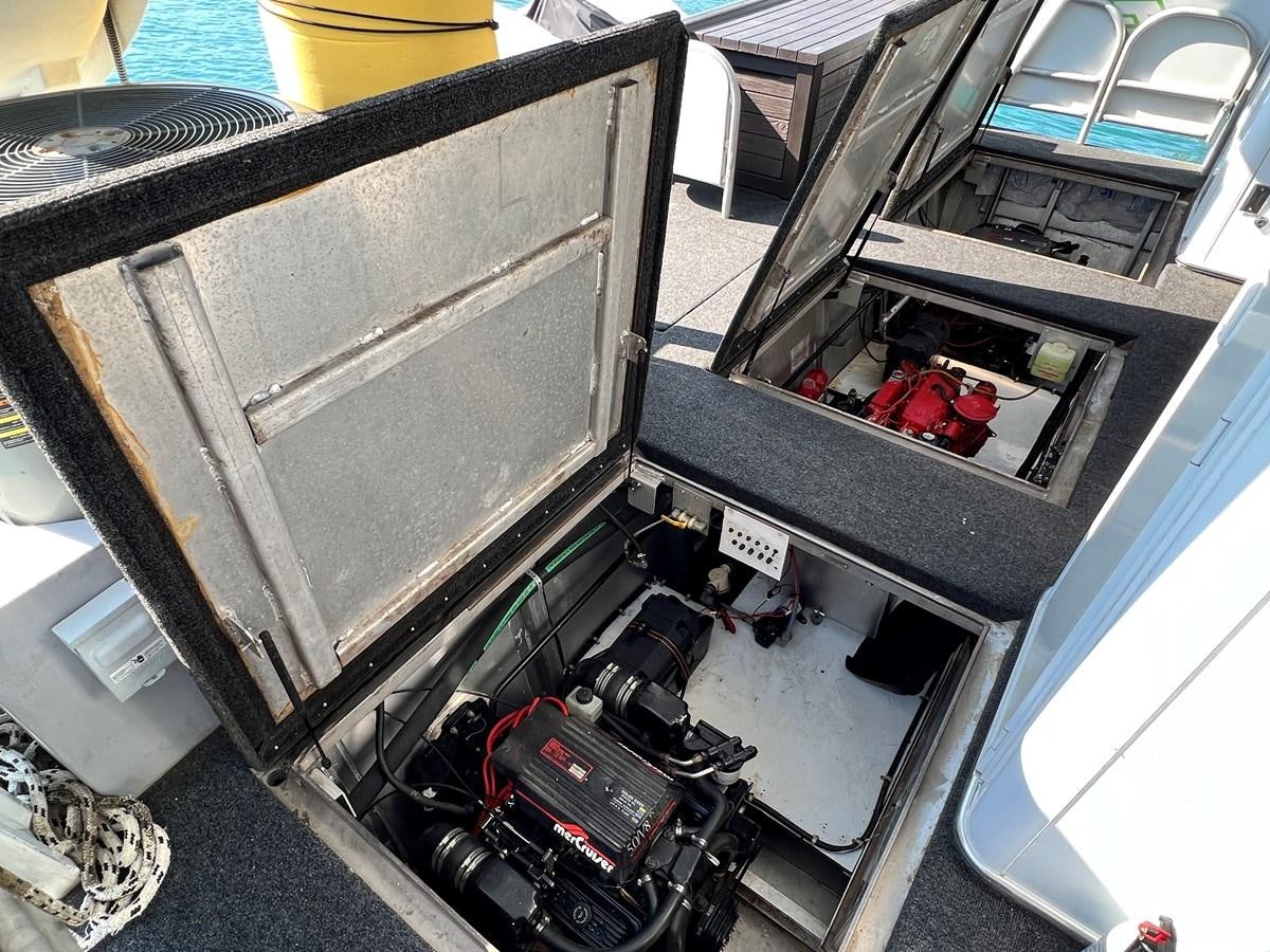 a car with a couple of people in it aboard 2010/1995 STARDUST 20 X 95WB NLST Yacht for Sale