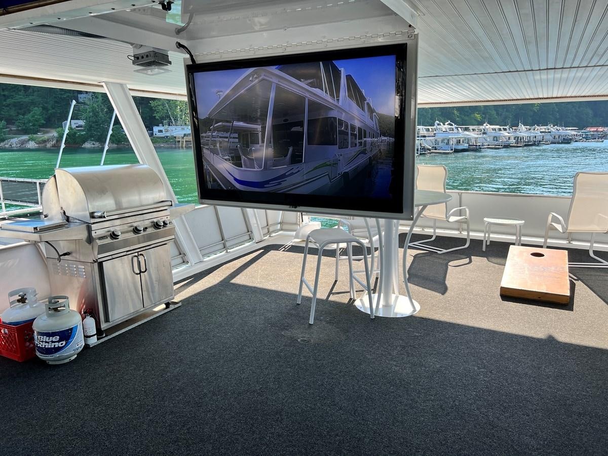 a large flat screen television on a table aboard 2010/1995 STARDUST 20 X 95WB NLST Yacht for Sale