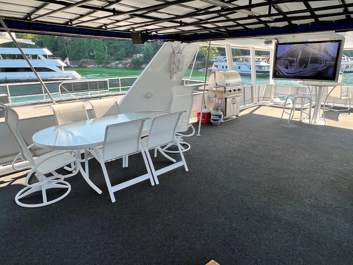 a group of chairs on a deck aboard 2010/1995 STARDUST 20 X 95WB NLST Yacht for Sale