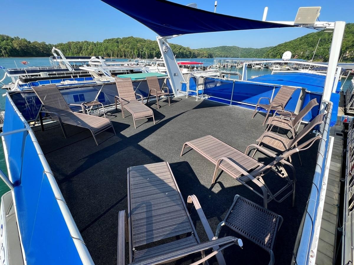 a deck with a deck chairs and a pool of water aboard 2010/1995 STARDUST 20 X 95WB NLST Yacht for Sale