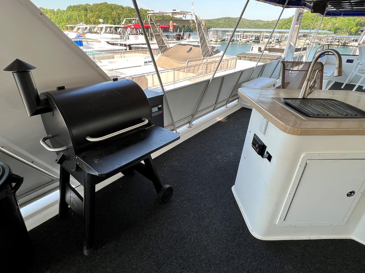 a chair next to a printer aboard 2010/1995 STARDUST 20 X 95WB NLST Yacht for Sale