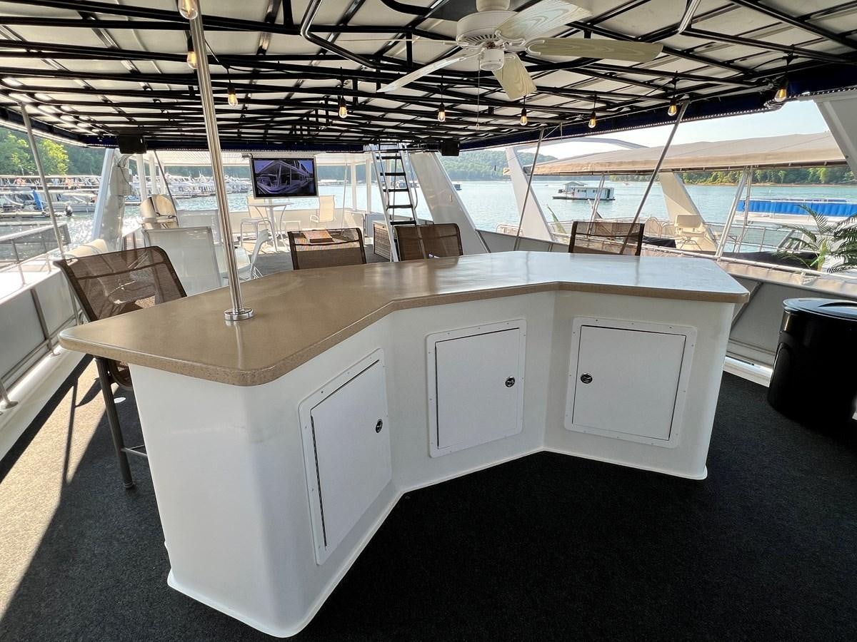 a large room with white cabinets aboard 2010/1995 STARDUST 20 X 95WB NLST Yacht for Sale